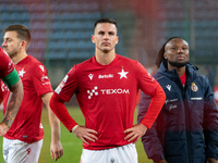 Angel Rodado and James Igbekeme stand together after the game between Wisla Krakow and GKS Tychy in Krakow, Poland, on November 4, 2024. Thi...