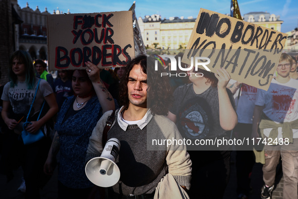 People attend a demonstration against the Polish government's plans to suspend the right to asylum for refugees illegally crossing the Polis...