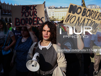 People attend a demonstration against the Polish government's plans to suspend the right to asylum for refugees illegally crossing the Polis...