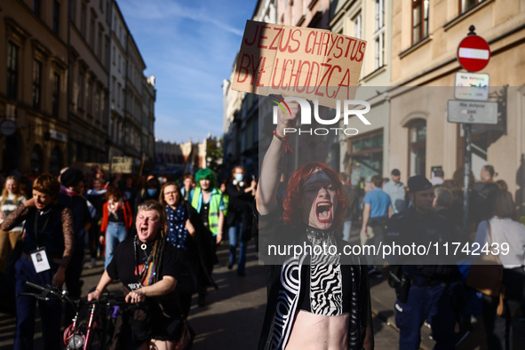 People attend a demonstration against the Polish government's plans to suspend the right to asylum for refugees illegally crossing the Polis...