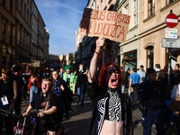 People attend a demonstration against the Polish government's plans to suspend the right to asylum for refugees illegally crossing the Polis...