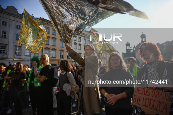 People attend a demonstration against the Polish government's plans to suspend the right to asylum for refugees illegally crossing the Polis...