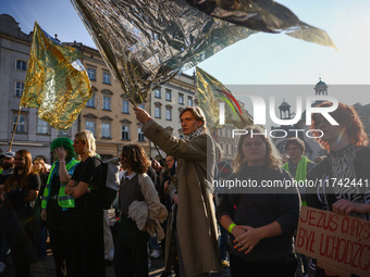 People attend a demonstration against the Polish government's plans to suspend the right to asylum for refugees illegally crossing the Polis...