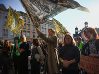 People attend a demonstration against the Polish government's plans to suspend the right to asylum for refugees illegally crossing the Polis...