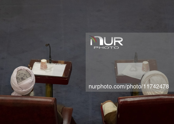 Shi'ite and Sunni Iranian clerics sit next to each other while participating in Iran's Assembly of Experts' biannual meeting at the old Iran...