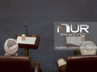 Shi'ite and Sunni Iranian clerics sit next to each other while participating in Iran's Assembly of Experts' biannual meeting at the old Iran...