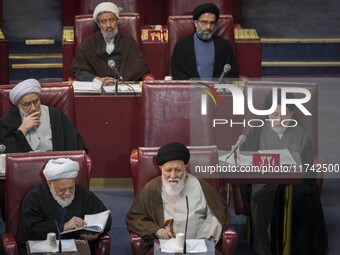 Ultra Conservative Shi'ite Iranian cleric, Ayatollah Sayyid Ahmad Alamolhoda (bottom R), sits at the old Iranian Parliament building while t...