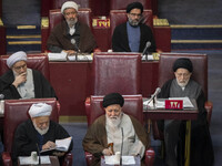 Ultra Conservative Shi'ite Iranian cleric, Ayatollah Sayyid Ahmad Alamolhoda (bottom R), sits at the old Iranian Parliament building while t...