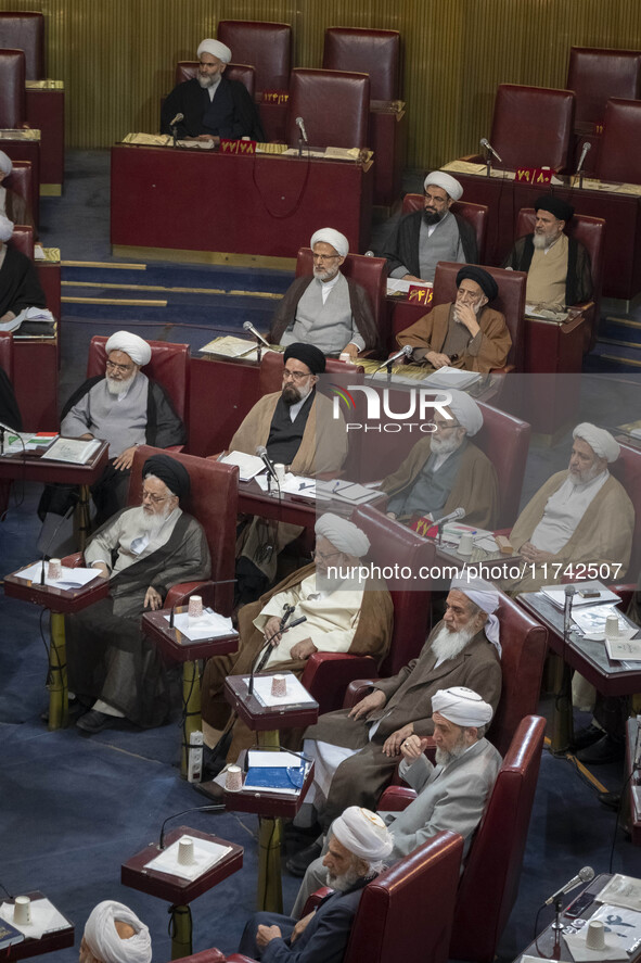 Shi'ite and Sunni Iranian clerics sit at the old Iranian Parliament building during Iran's Assembly of Experts' biannual meeting in Tehran,...