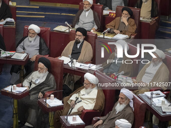 Shi'ite and Sunni Iranian clerics sit at the old Iranian Parliament building during Iran's Assembly of Experts' biannual meeting in Tehran,...