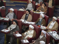 Shi'ite and Sunni Iranian clerics sit at the old Iranian Parliament building during Iran's Assembly of Experts' biannual meeting in Tehran,...