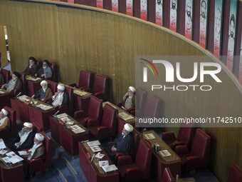 Iranian clerics sit at the old Iranian Parliament building during Iran's Assembly of Experts' biannual meeting in Tehran, Iran, on November...