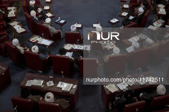 Iranian clerics sit at the old Iranian Parliament building during Iran's Assembly of Experts' biannual meeting in Tehran, Iran, on November...