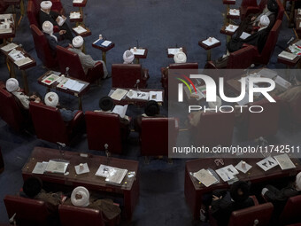 Iranian clerics sit at the old Iranian Parliament building during Iran's Assembly of Experts' biannual meeting in Tehran, Iran, on November...