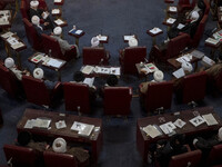 Iranian clerics sit at the old Iranian Parliament building during Iran's Assembly of Experts' biannual meeting in Tehran, Iran, on November...