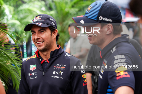 Sergio Perez and Max Verstappen of Red Bull Racing RB20 pose for a portrait during the Formula 1 Grand Prix of Brazil at Autodromo Jose Carl...