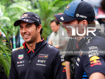 Sergio Perez and Max Verstappen of Red Bull Racing RB20 pose for a portrait during the Formula 1 Grand Prix of Brazil at Autodromo Jose Carl...