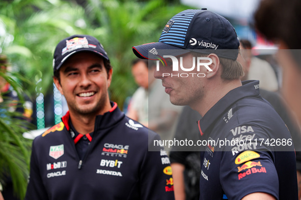 Sergio Perez and Max Verstappen of Red Bull Racing RB20 pose for a portrait during the Formula 1 Grand Prix of Brazil at Autodromo Jose Carl...