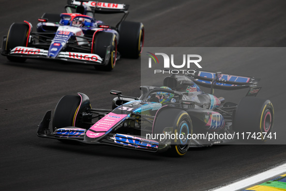 Esteban Ocon of the Alpine F1 Team A524 and Liam Lawson of the Visa Cash App RB F1 Team VCARB 01 compete during the Formula 1 Grand Prix of...