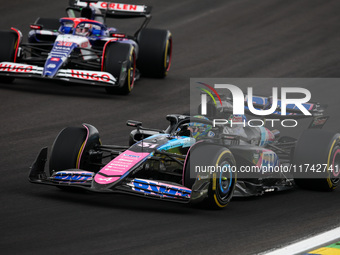 Esteban Ocon of the Alpine F1 Team A524 and Liam Lawson of the Visa Cash App RB F1 Team VCARB 01 compete during the Formula 1 Grand Prix of...