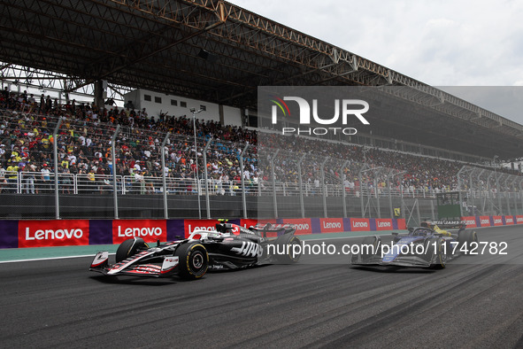 Nico Hulkenberg of Haas F1 Team and Alexander Albon of Williams Racing compete during the Formula 1 Grand Prix of Brazil at Autodromo Jose C...