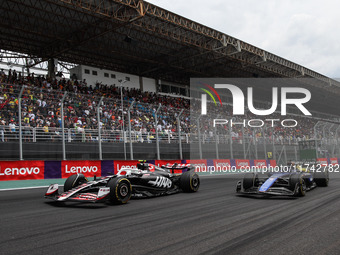 Nico Hulkenberg of Haas F1 Team and Alexander Albon of Williams Racing compete during the Formula 1 Grand Prix of Brazil at Autodromo Jose C...