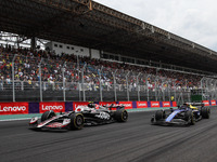 Nico Hulkenberg of Haas F1 Team and Alexander Albon of Williams Racing compete during the Formula 1 Grand Prix of Brazil at Autodromo Jose C...