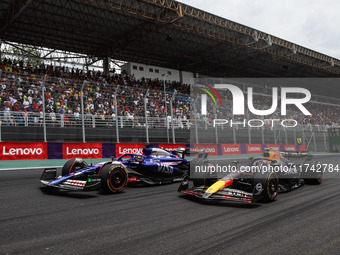 Liam Lawson of Visa Cash App RB F1 Team VCARB 01 and Sergio Perez of Red Bull Racing RB20 participate in the Formula 1 Grand Prix of Brazil...