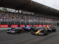 Liam Lawson of Visa Cash App RB F1 Team VCARB 01 and Sergio Perez of Red Bull Racing RB20 participate in the Formula 1 Grand Prix of Brazil...