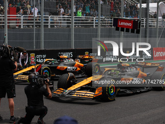 Lando Norris of the McLaren F1 Team MCL38 and Oscar Piastri of the McLaren F1 Team MCL38 participate in the Formula 1 Grand Prix of Brazil a...