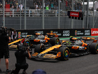 Lando Norris of the McLaren F1 Team MCL38 and Oscar Piastri of the McLaren F1 Team MCL38 participate in the Formula 1 Grand Prix of Brazil a...