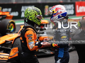 Lando Norris of McLaren F1 Team MCL38 and Max Verstappen of Red Bull Racing RB20 pose for a portrait during the Formula 1 Grand Prix of Braz...