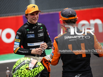 Oscar Piastri of the McLaren F1 Team MCL38 and Lando Norris of the McLaren F1 Team MCL38 pose for a portrait during the Formula 1 Grand Prix...