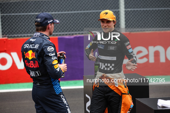 Max Verstappen of Red Bull Racing RB20 and Oscar Piastri of McLaren F1 Team MCL38 pose for a portrait during the Formula 1 Grand Prix of Bra...