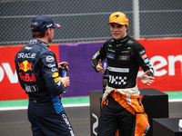 Max Verstappen of Red Bull Racing RB20 and Oscar Piastri of McLaren F1 Team MCL38 pose for a portrait during the Formula 1 Grand Prix of Bra...