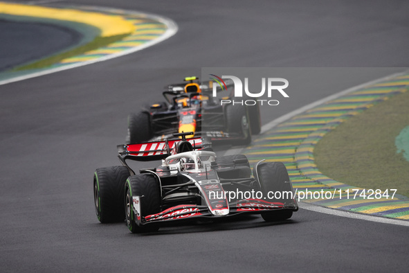 Oliver Bearman of Haas F1 Team VF-24 Ferrari and Sergio Perez of Red Bull Racing RB20 compete during the Formula 1 Grand Prix of Brazil at A...