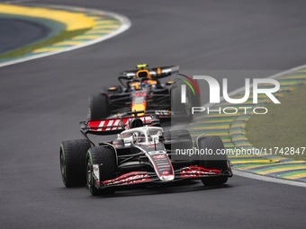 Oliver Bearman of Haas F1 Team VF-24 Ferrari and Sergio Perez of Red Bull Racing RB20 compete during the Formula 1 Grand Prix of Brazil at A...