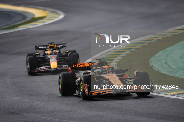 Oscar Piastri of the McLaren F1 Team and Max Verstappen of Red Bull Racing compete during the Formula 1 Grand Prix of Brazil at Autodromo Jo...