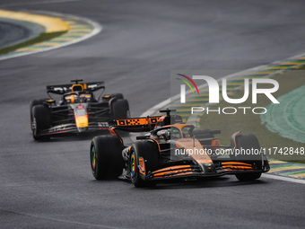 Oscar Piastri of the McLaren F1 Team and Max Verstappen of Red Bull Racing compete during the Formula 1 Grand Prix of Brazil at Autodromo Jo...