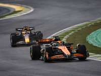 Oscar Piastri of the McLaren F1 Team and Max Verstappen of Red Bull Racing compete during the Formula 1 Grand Prix of Brazil at Autodromo Jo...