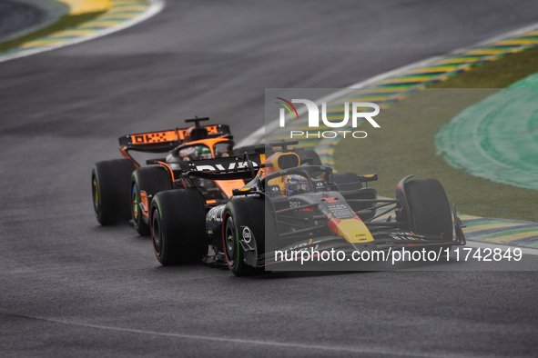 Max Verstappen of Red Bull Racing RB20 and Oscar Piastri of McLaren F1 Team MCL38 compete during the Formula 1 Grand Prix of Brazil at Autod...