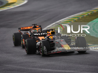 Max Verstappen of Red Bull Racing RB20 and Oscar Piastri of McLaren F1 Team MCL38 compete during the Formula 1 Grand Prix of Brazil at Autod...