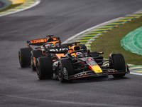 Max Verstappen of Red Bull Racing RB20 and Oscar Piastri of McLaren F1 Team MCL38 compete during the Formula 1 Grand Prix of Brazil at Autod...