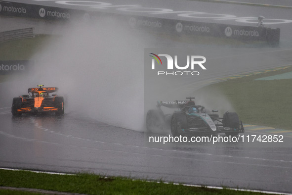 George Russell of the Mercedes AMG F1 Team W15 and Lando Norris of the McLaren F1 Team MCL38 participate in the Formula 1 Grand Prix of Braz...