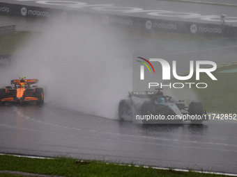 George Russell of the Mercedes AMG F1 Team W15 and Lando Norris of the McLaren F1 Team MCL38 participate in the Formula 1 Grand Prix of Braz...