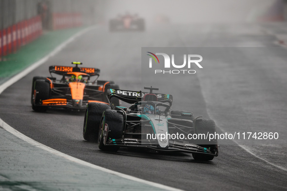 George Russell of the Mercedes AMG F1 Team W15 and Lando Norris of the McLaren F1 Team MCL38 participate in the Formula 1 Grand Prix of Braz...