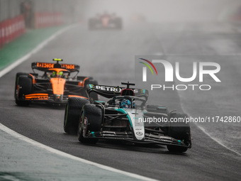 George Russell of the Mercedes AMG F1 Team W15 and Lando Norris of the McLaren F1 Team MCL38 participate in the Formula 1 Grand Prix of Braz...