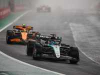 George Russell of the Mercedes AMG F1 Team W15 and Lando Norris of the McLaren F1 Team MCL38 participate in the Formula 1 Grand Prix of Braz...