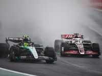 Lewis Hamilton of the Mercedes AMG F1 Team W15 and Oliver Bearman of the Haas F1 Team VF-24 Ferrari participate in the Formula 1 Grand Prix...