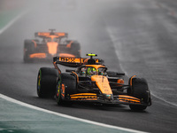 Lando Norris of the McLaren F1 Team, driving the MCL38, and Oscar Piastri of the McLaren F1 Team, also driving the MCL38, participate in the...